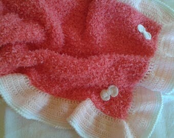 crochet baby blanket, plaid and needles