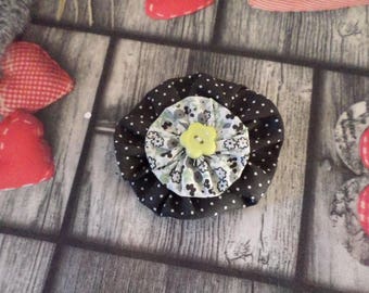brooch in black and green tones