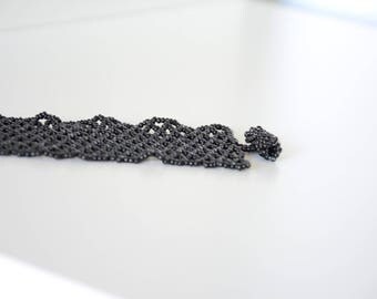 Hand woven black beaded bracelet