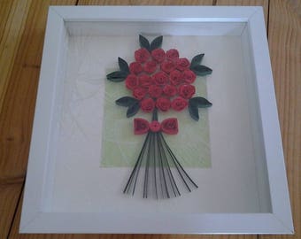 table quilling depicting a bouquet of roses