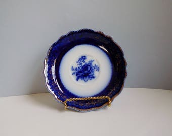 Vintage flow blue plate Blue and white saucer