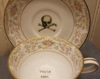 You've been poisoned tea cup and saucer
