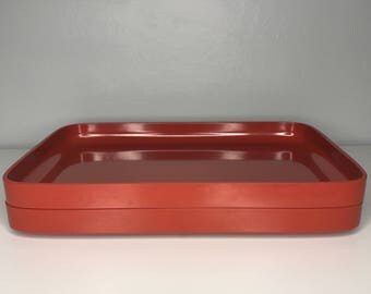 set of two stackable retro Rosti Denmark Falle Uldall melamine plates in rust red