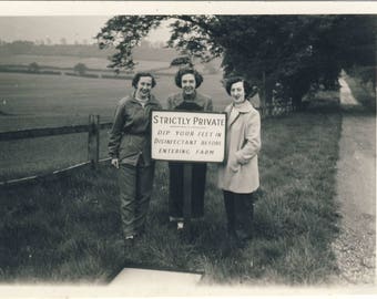 Women at farm, with warning notice, Vintage photograph c1940s