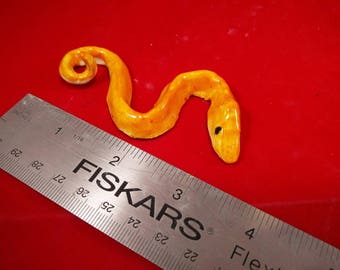 Ceramic Snake Bites magnet, ornament, keychain, or figurine - your choice