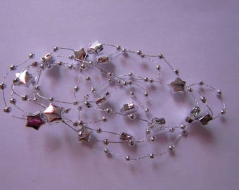silver thread with balls and stars