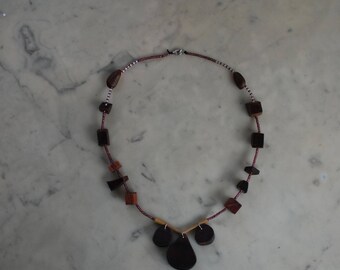 Necklace with wood of various shapes, bamboo, seeds beads and glass beads