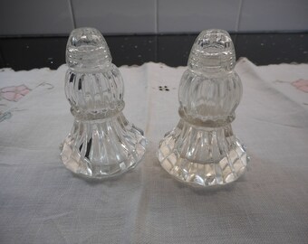 Beautiful pressed glass salt and pepper shakers with glass lids. Very lovely set.