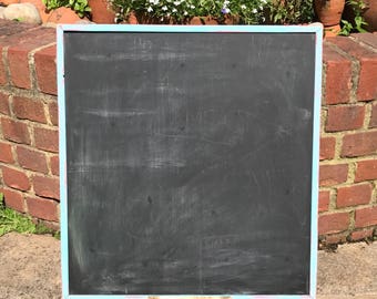 Medium sized blackboard or chalkboard with distressed frame and chalk tray