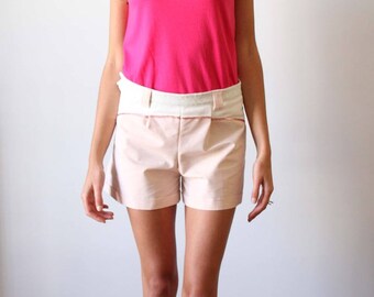 Shorts with thin stripes and Tangerine color cuts