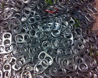 Green, Red, and Silver Soda Tab it can be used to make bracelets, purses or lamps. Use them for any crafts . comes in 100 or 200s or 300