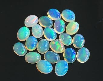 ON SALE Natural Ethiopian Opal 8x6 mm Round Cabochons. Excellent Quality Material with Amazing play of colors. Priced Individually