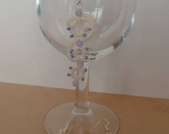 White tatting earrings and pale blue beads