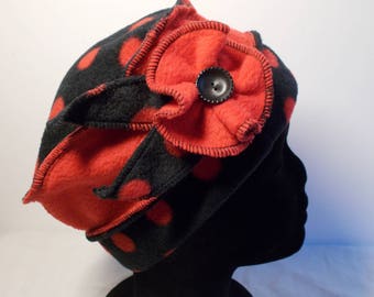 Hat hat in red and black fleece with red polka dots