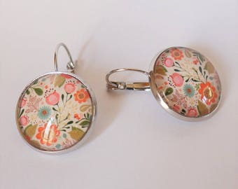 Stud Earrings with flowers on white background