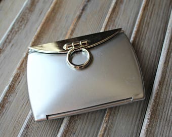 Silver. Compact. Mirror.