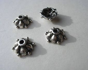 Set of 4 antique silver caps