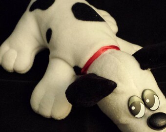 black and white spotted stuffed dog