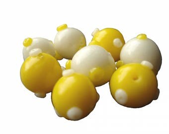 8 yellow and white porcelain beads