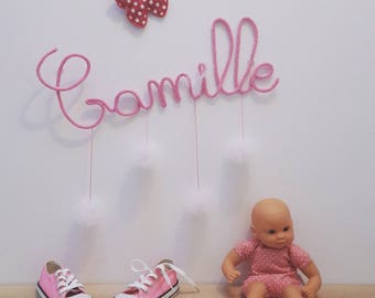 Name of knitting with hanging tulle pom poms