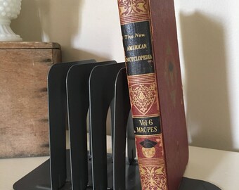 Four (4) Industrial Vintage Metal Bookends