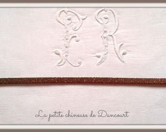 Glittery gold leather strap