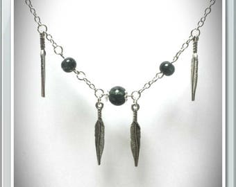 Long silver necklace with feathers