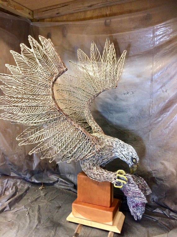 Metal wire Sculpture of Bald Eagle catching fish