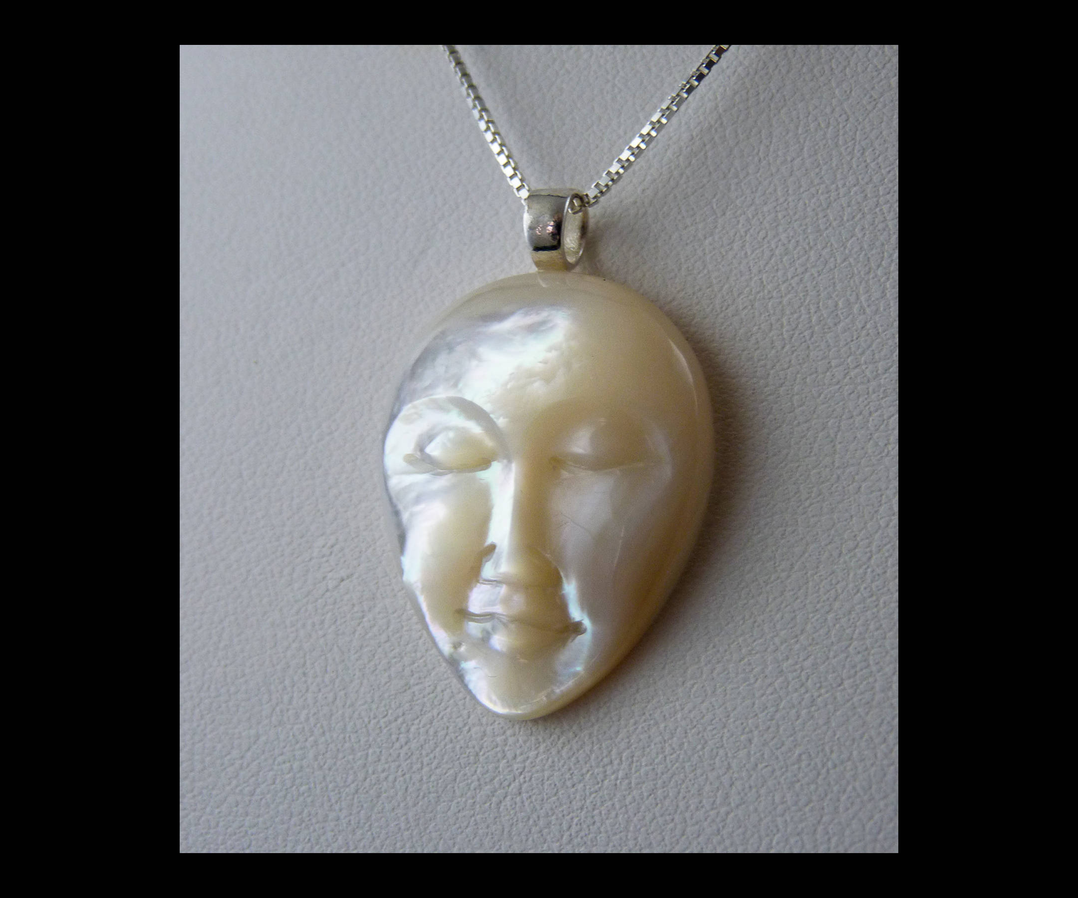 Mother of Pearl Hand Carved Moon Face Pendant White