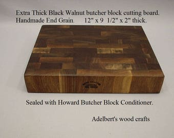 Extra thick Black Walnut end grain cutting board the right size at the right price. 12"x 9 3/4" x 2" thick. Shipped priority mail.