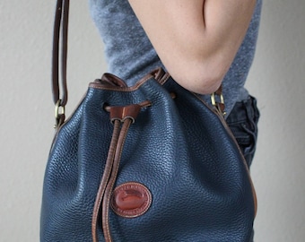 Vintage Dooney & Bourke Medium Drawstring Bucket Bag in Navy + Brown