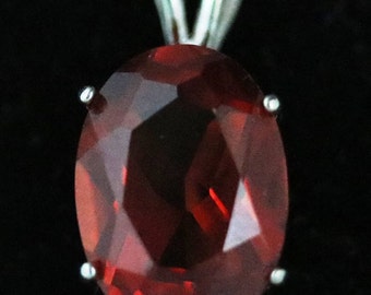 Sapphire, Padparadsha, 4 prong silver bezel 12ct