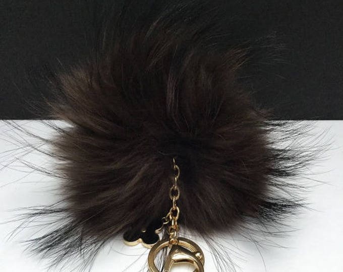 Deep brown with natural markings Raccoon Fur Pom Pom luxury bag pendant + black flower clover charm keychain