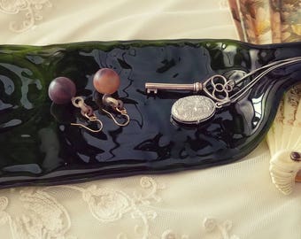 Spiral motif slumped glass bottle