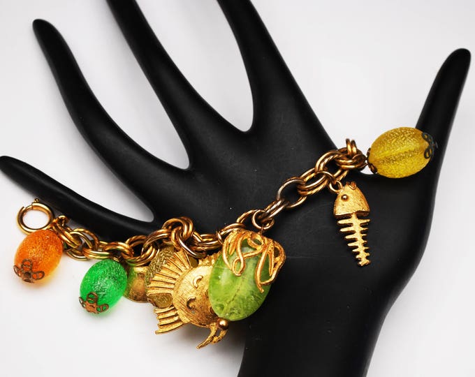 Cha cha Bracelet - colorful Tutti Frutti - gold fish -yellow orange green lucite - plastic - gold bell - dangle Bangle