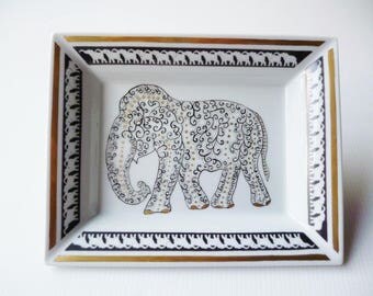empty pockets porcelain elephant of Siam