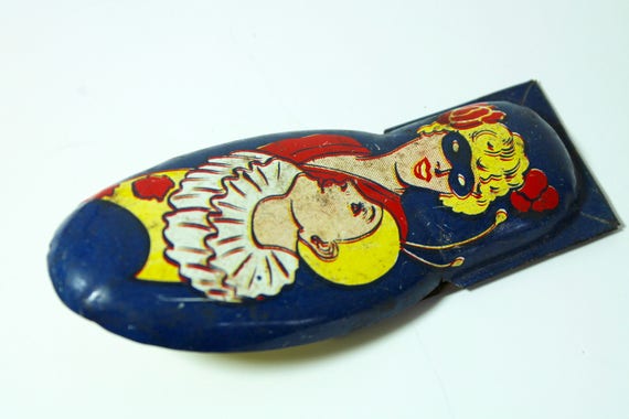 tin clicker toy
