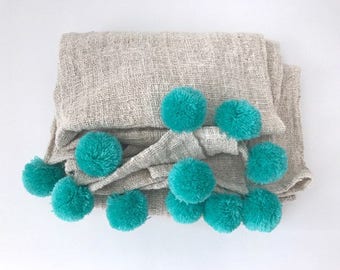 Natural with turquoise pom pom blanket
