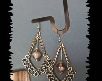 Earrings in bronze and glass bead