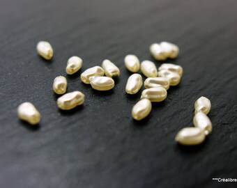Lot de 10 perles blanches 7x4 mm