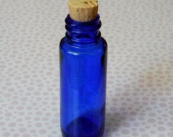 Deep Cobalt Blue Glass Medicine Bottle. Reminds us of Alice's Adventures in Wonderland "DRINK ME" bottle. Half oz. Volume w/New Cork Stopper