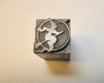 Vintage printer's block. Halloween Witch on Broom in front of Moon. Vintage collectible block for. Clip Art wingding metal block