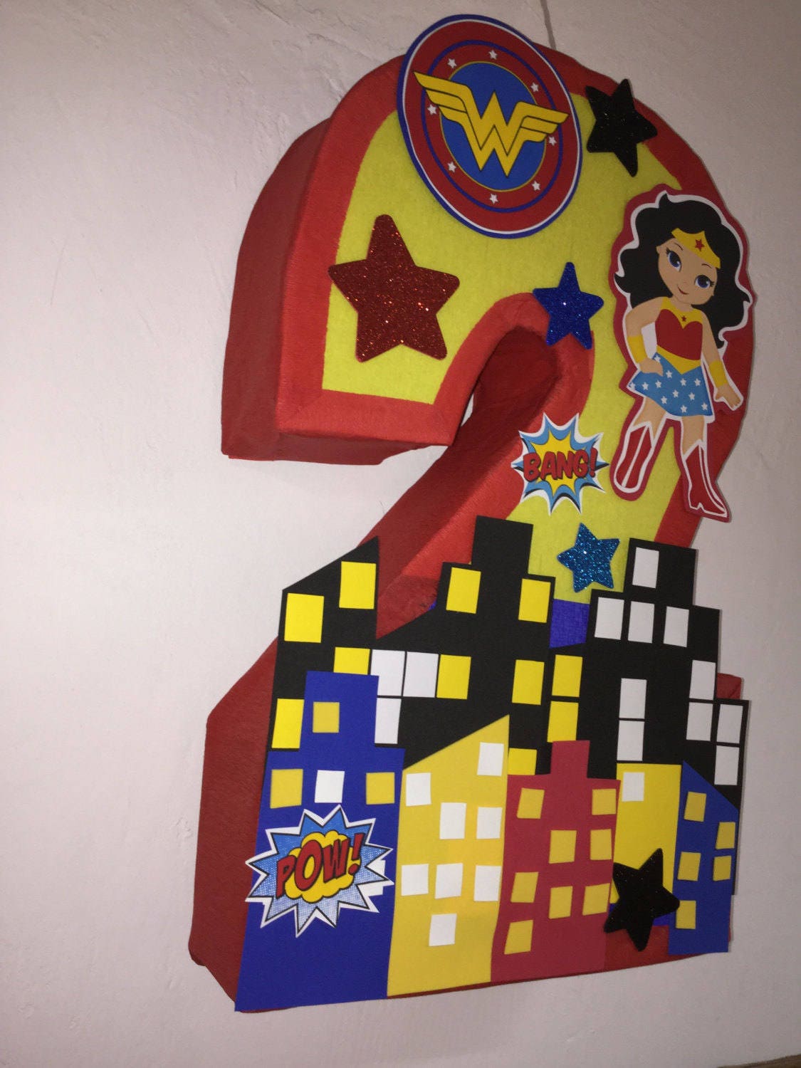 To Alaska Wonder Woman pinata. number decorated Birthday Party decoration. Wonder woman Pinata.