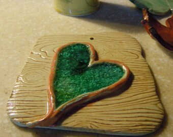 Handmade pottery wall plaque with turquoise heart