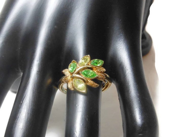 Avon Leaf Lights Ring, adjustable from 6 to 8, 1974 green marquis cut faux emerald & Peridot rhinestone leaves, gold tone setting