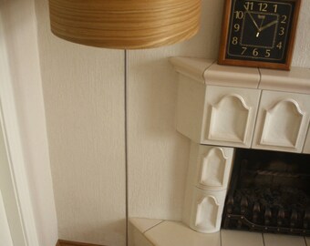 Wood veneer floor lamp with stainless steel lamp stand.