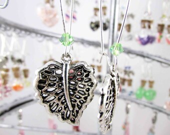 Earrings in silvery metal leaf