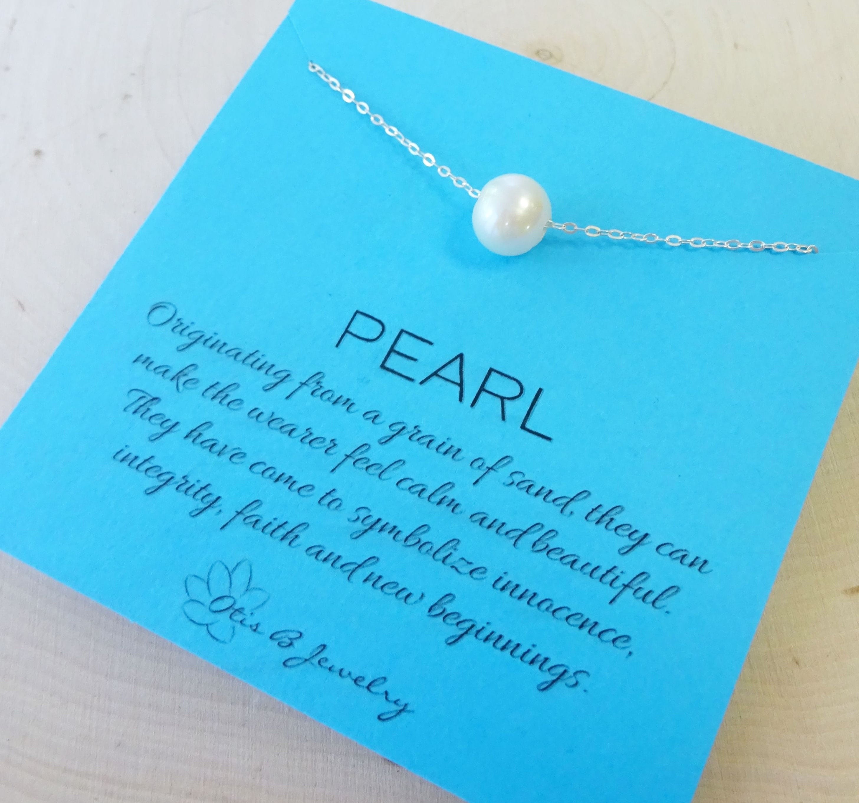 floating-pearl-necklace-pearl-meaning-symbolic-symbolism