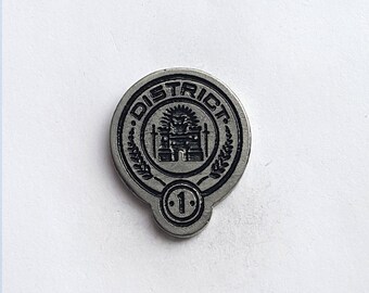 Hand Cast District One (Hunger Games) 1 in. Lapel Pin