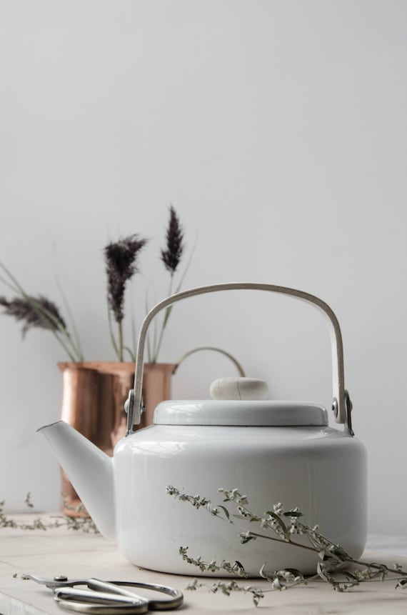 Vintage white enamel kettle with wooden handle